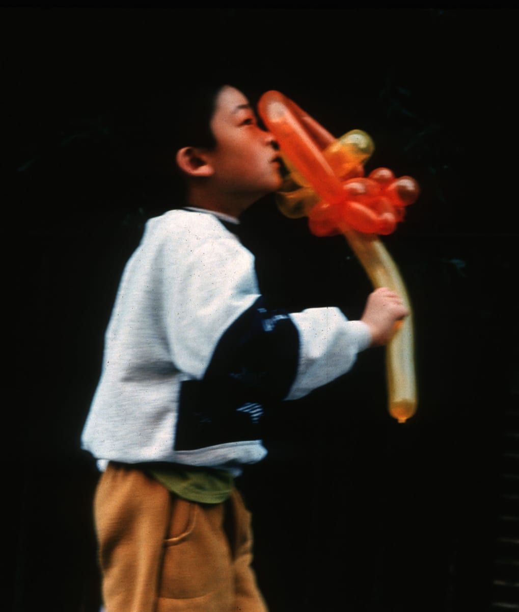 Boy with Balloon by Robert Welsh 