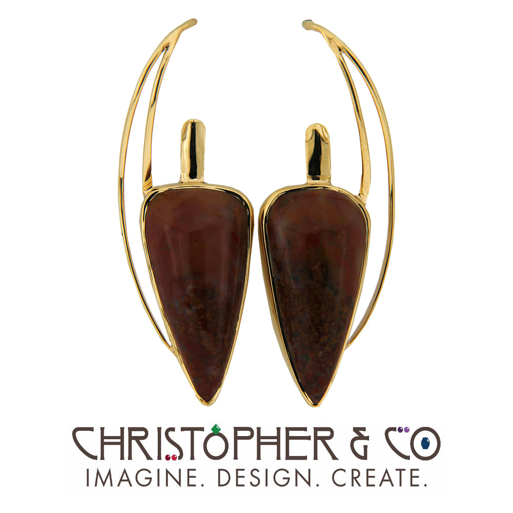 CMJ B 22020  14 karat yellow gold earrings set with Dinosaur Bone cabachons & designed by Christopher M. Jupp.  Image: CMJ B 22020  14 karat yellow gold earrings set with Dinosaur Bone cabachons & designed by Christopher M. Jupp.
