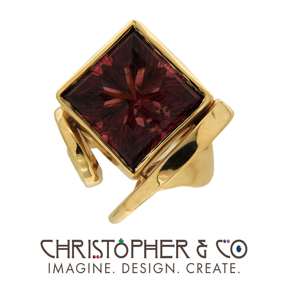 CMJ E 21084   Gold ring set with concave cut rubellite tourmaline handcut by Richard Homer, designed by Christopher M. Jupp.  Image: CMJ E 21084   Gold ring set with concave cut rubellite tourmaline handcut by Richard Homer, designed by Christopher M. Jupp.