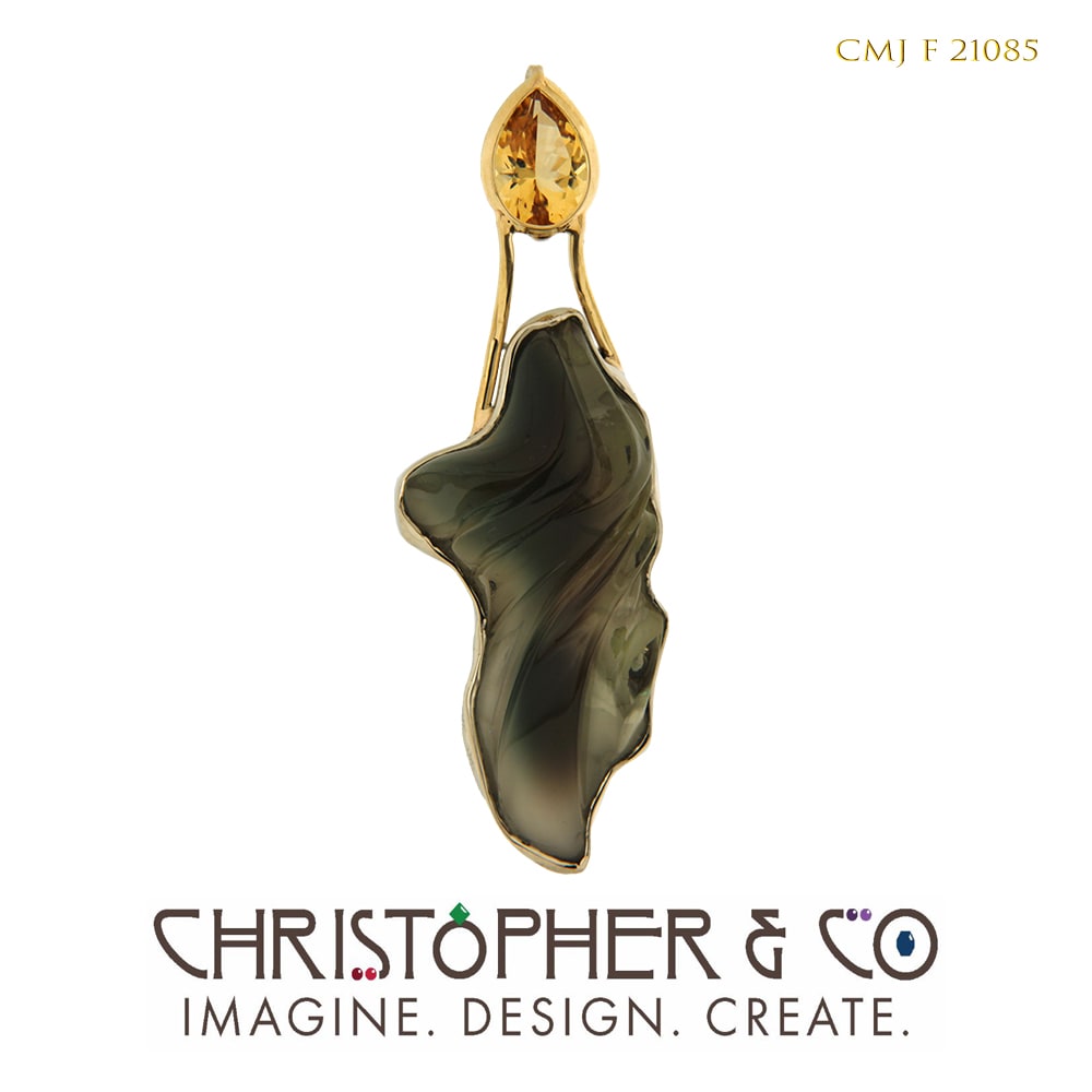CMJ F 21085  Gold pendant designed by Christopher M. Jupp set with golden beryl and sunstone which was handcarved by Darryl Alexander. by Christopher M. Jupp  Image: CMJ F 21085  Gold pendant designed by Christopher M. Jupp set with golden beryl and sunstone which was handcarved by Darryl Alexander.