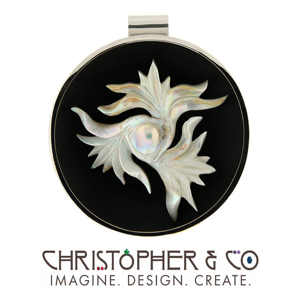 CMJ G 22005   White gold and silver pendant designed by Christopher M. Jupp & set with carved pearl by Darryl Alexander.  Image: CMJ G 22005   White gold and silver pendant designed by Christopher M. Jupp & set with carved pearl by Darryl Alexander.