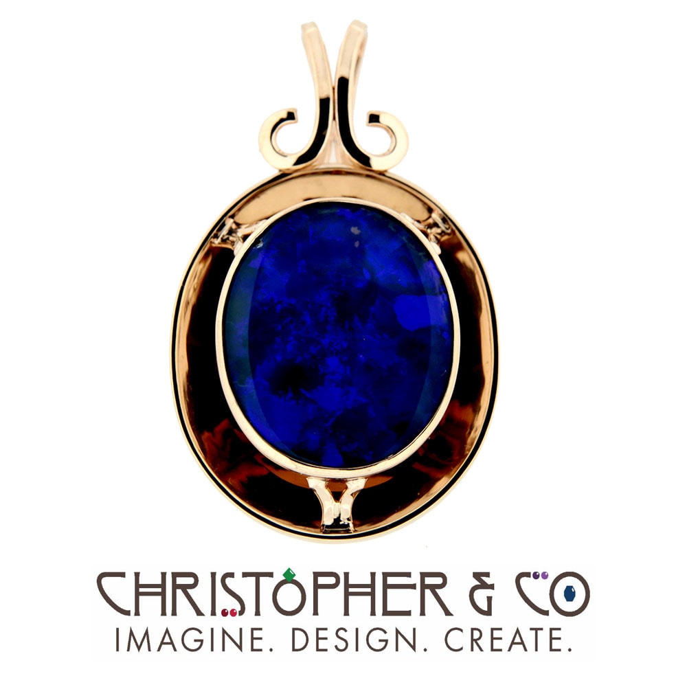 CMJ H 13126    Gold pendant set with opal in front of concave mirror designed by Christopher M. Jupp.  Image: CMJ H 13126    Gold pendant set with opal in front of concave mirror designed by Christopher M. Jupp.