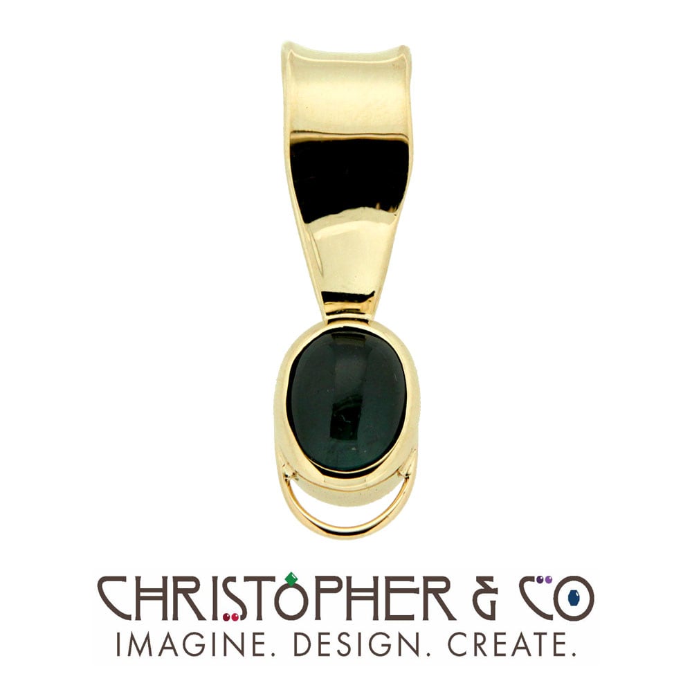 CMJ H 13194    Gold pendant set with blue tourmaline cabachon designed by Christopher M. Jupp.  Image: CMJ H 13194    Gold pendant set with blue tourmaline cabachon designed by Christopher M. Jupp.