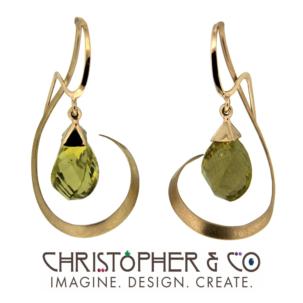 CMJ J 13002    Gold earring pair set with Oro Verde quartz hand faceted by Richard Homer and designed by Christopher M. Jupp.  Image: CMJ J 13002    Gold earring pair set with Oro Verde quartz hand faceted by Richard Homer and designed by Christopher M. Jupp.