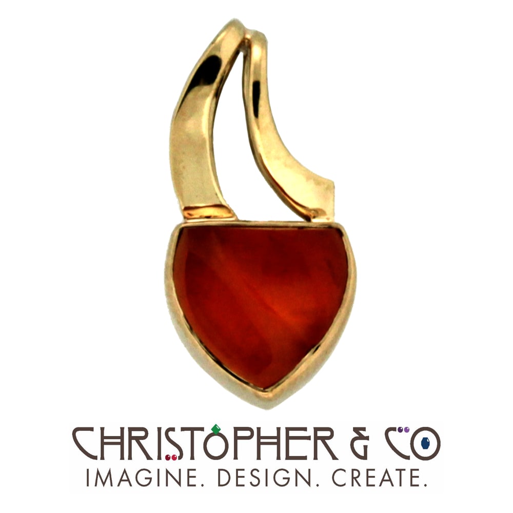 CMJ J 13040    Gold pendant set with fire opal designed by Christopher M. Jupp.  Image: CMJ J 13040    Gold pendant set with fire opal designed by Christopher M. Jupp.