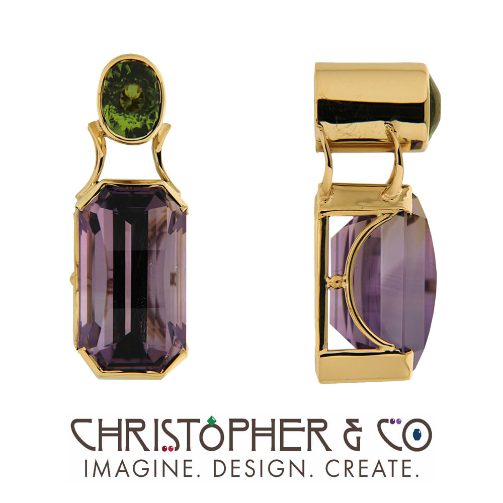 CMJ J 21150 Gold pendant set with Pakistani peridot and amethyst designed by Christopher M. Jupp.  Image: CMJ J 21150 Gold pendant set with Pakistani peridot and amethyst designed by Christopher M. Jupp.