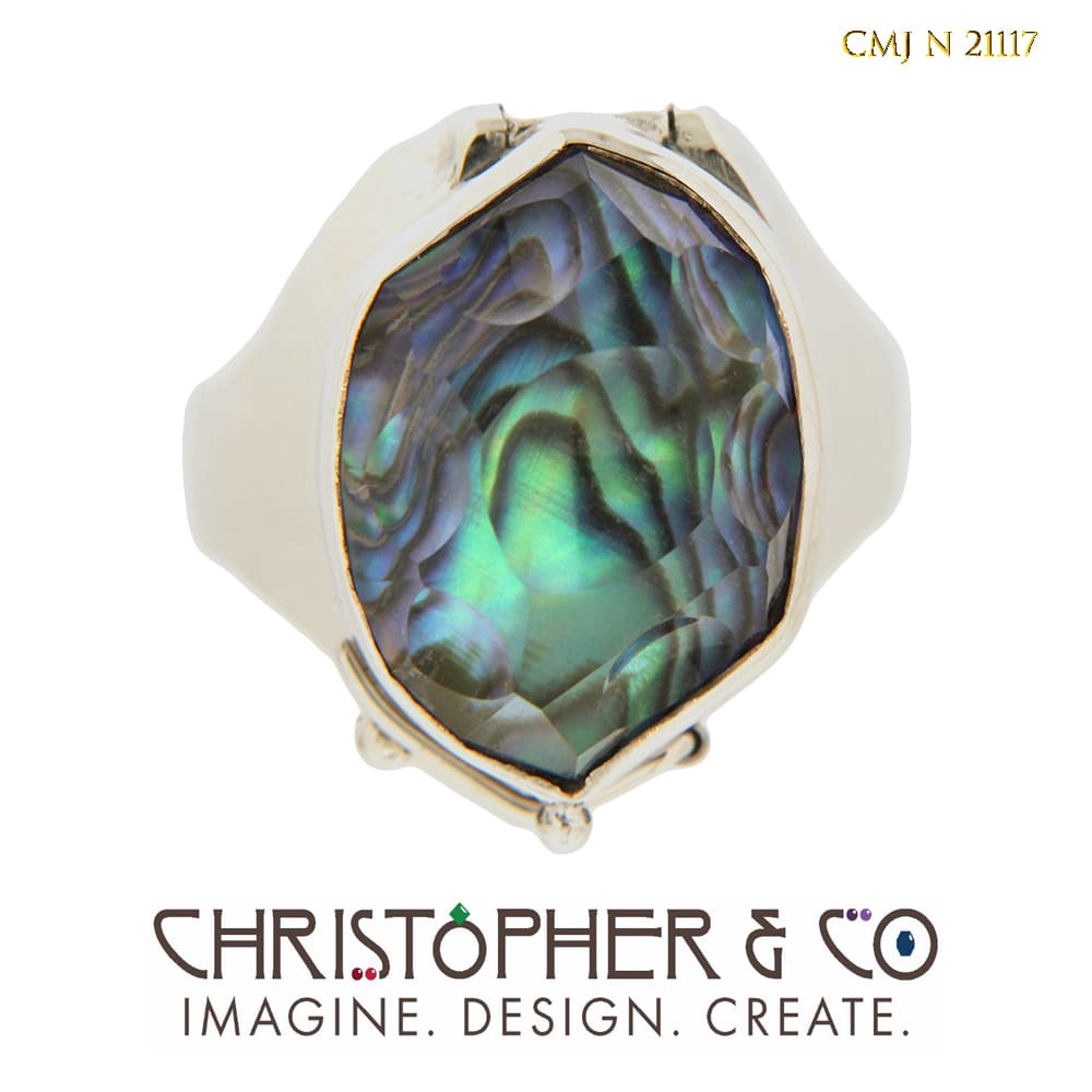 CMJ N 21117  White gold ring designed by Christopher M. Jupp set with a mother of pearl triplet handcut by Richard Homer. by Christopher M. Jupp  Image: CMJ N 21117  White gold ring designed by Christopher M. Jupp set with a mother of pearl triplet handcut by Richard Homer.