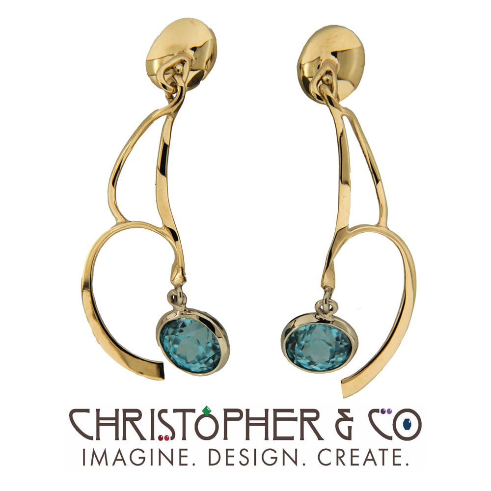 CMJ P 21107   Gold earring pair set with blue zircon designed by Christopher M. Jupp.  Image: CMJ P 21107   Gold earring pair set with blue zircon designed by Christopher M. Jupp.
