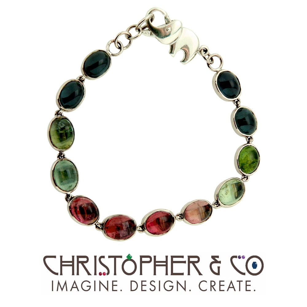 CMJ R 13184    Gold bracelet set with bicolor tourmalines designed by Christopher M. Jupp.  Image: CMJ R 13184    Gold bracelet set with bicolor tourmalines designed by Christopher M. Jupp.