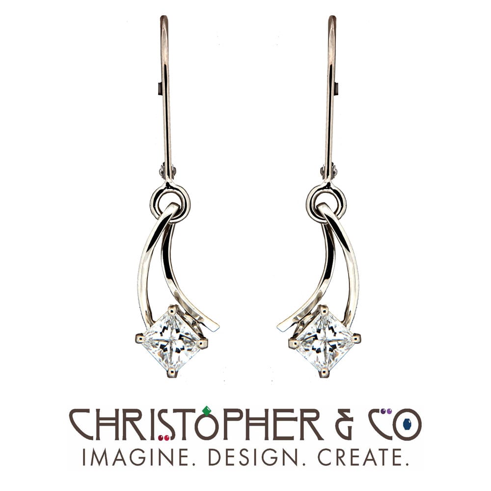 CMJ W 13095  White Gold Earrings set with princess cut diamonds designed by Christopher M. Jupp  Image: CMJ W 13095  White Gold Earrings set with princess cut diamonds designed by Christopher M. Jupp