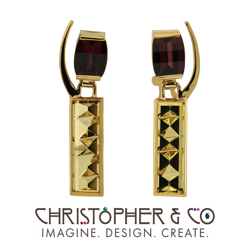 CMJ W 21153  Gold Earring Pair designed by Christopher M. Jupp set with Garnets and Heliodor hand cut by Brian Messing.  Image: CMJ W 21153  Gold Earring Pair designed by Christopher M. Jupp set with Garnets and Heliodor hand cut by Brian Messing.