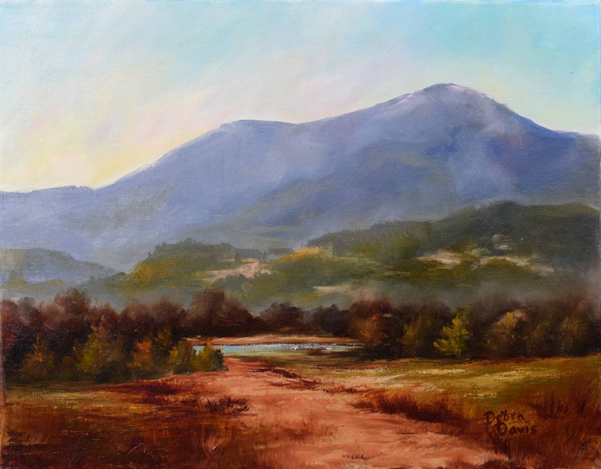 Almost There by Debra Davis  Image: Sometimes the most meaningful part of the journey is just before you arrive — when the path curves quietly, the sky opens wide, and the land begins to feel like home. “Almost There” is a tribute to those in-between places that invite us to pause, reflect, and remember where we’re going.