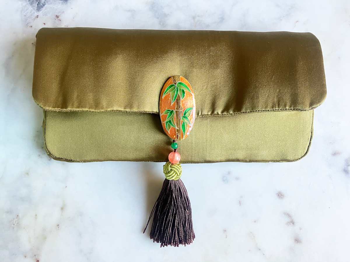 Bamboozled by Suzanna Gallehugh  Image: Suzanna Gallehugh, "Bamboozled", 2024, vitreous enamel, sterling silver, and silk, 11 x 5.5 x 0.75 in.