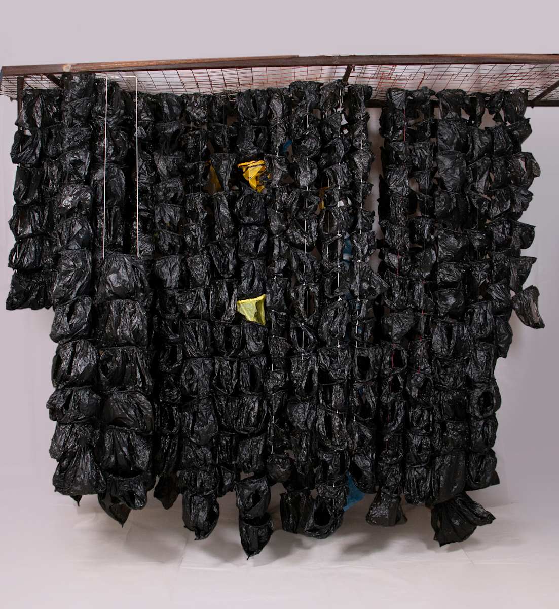 We Trusted, So We Gave You Our Hearts, Gathered in a Bag, and We Waited (About Black and the Bag Wall Series) by Amarachi Okafor (Orie) 