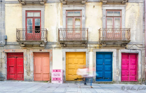 Running Figures  Image: Late night revelers running past coloured doors in Porto, Portugal