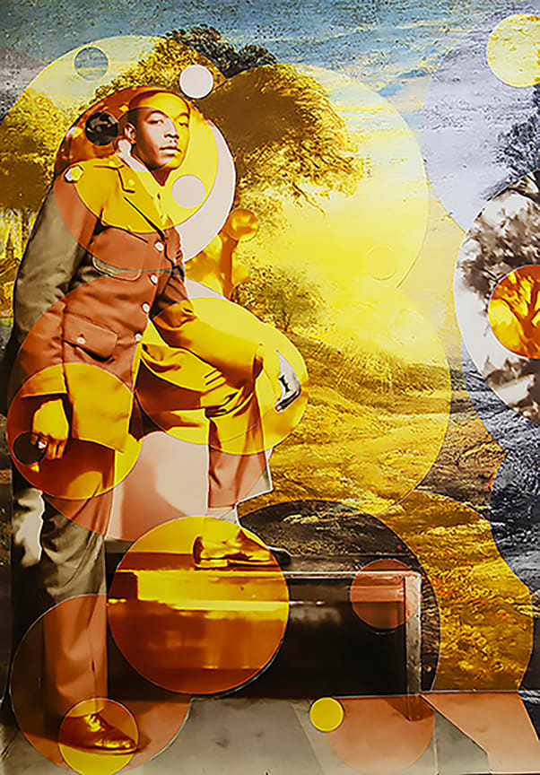 Untitled by Gary Burnley  Image: Alt text long description: The digital photo collage features a man dressed in a brown military uniform, positioned with one foot on a low, rectangular object. The background consists of a painterly landscape, showcasing trees and a soft-focus sky with shades of yellow and blue. Distinctive circular overlays in various shades of yellow and orange are superimposed across the image, creating a layered effect. These circles vary in size and opacity, blending with the photo and painted background, adding a modern and abstract component to the composition. Note: the alt text was written with support from the ASU Image Accessibility Creator AI tool. 