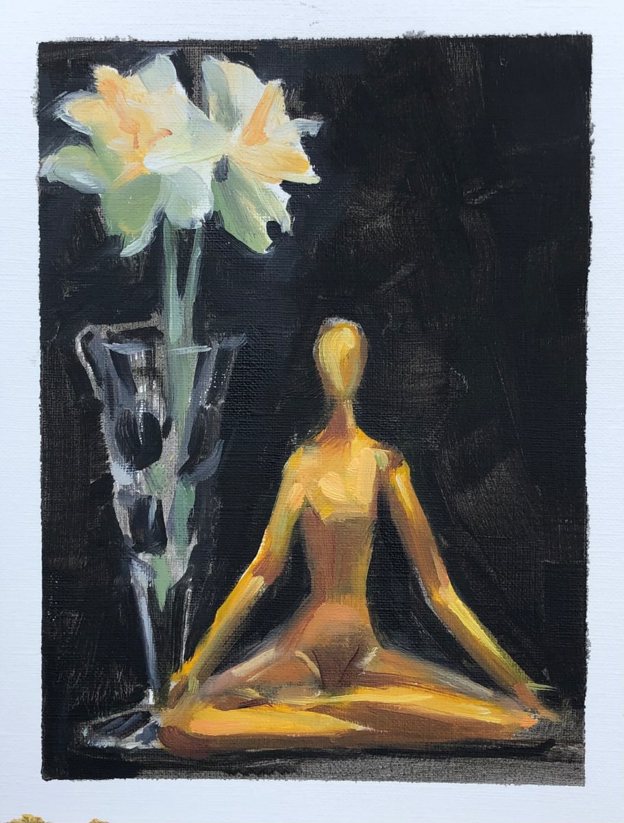 OM  Image: A pair of double daffodils and and a gold yoga figurine.
