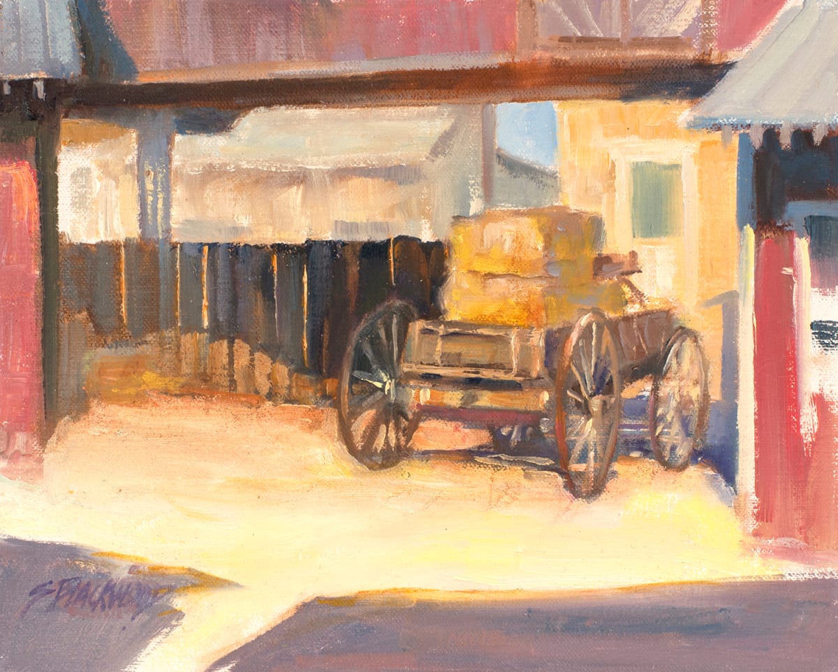 Parked  Image: I loved this old wagon with bales of hay. The abstract shadows and buildings added to the composition.