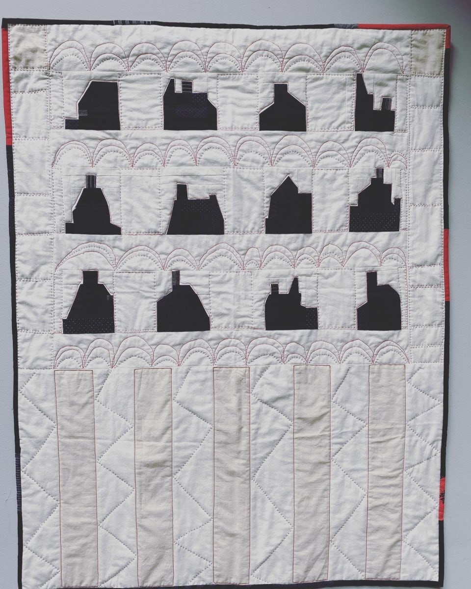 "Houses in the night"  Image: improv quilt machine pieced , machine and hand quilted . 