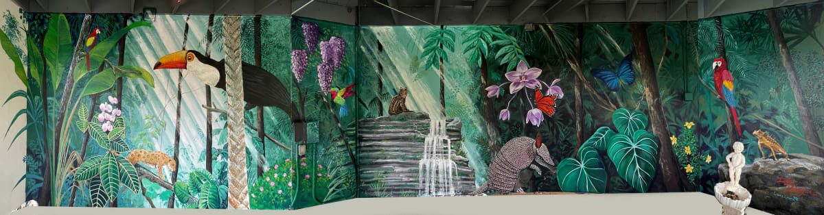 Tropical Forest Fantasy by Dan Terry  Image: This commissioned mural "Tropical Forest Fantasy" adorns a beautiful semi outdoor patio for a health clinic developer's home near Austin, TX. The work is 8' tall by nearly 70' long done entirely in Acrylic artist paints, done in 2022. Some of the featured creatures in the work are an endangered Ocelot, 9-banded armadillo, toucan, ruby throated hummingbird, and a threatened Texas Horny Toad. Orchids, Wisterias and a host of other tropical plants and flowers add brilliant spots of color. 