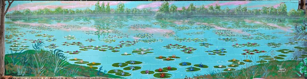 Lake Monet Waterlily Fantasy Mural by Dan Terry  Image: It's not often a client commission comes with the invitation to just paint whatever you get inspired to create. This 6x24' exterior mural was the happy result, influenced by Monet's waterlilies with a contemporary twist.  Here's what the client said in a review posted online: "I am still so excited about my experience and the results of Mr Terry ‘s outstanding transformation of my so sad cement wall my neighbor gifted me with.
I was not at all happy sitting by my pool and then I decided to do something about it . I didn’t know what or how to go about it .Then The mighty Heavens from above somehow blessed me with Mr Terry and his magical paint brush . He drove all the way from Austin to San Antonio for about 3 or 4 days and in less than I week I could throw away my antidepressants because I have been on a natural high ever since . His art has not just created beauty but restored my love of life because of people like him who can make things thought impossibly ugly into a true neighborhood piece of art ."