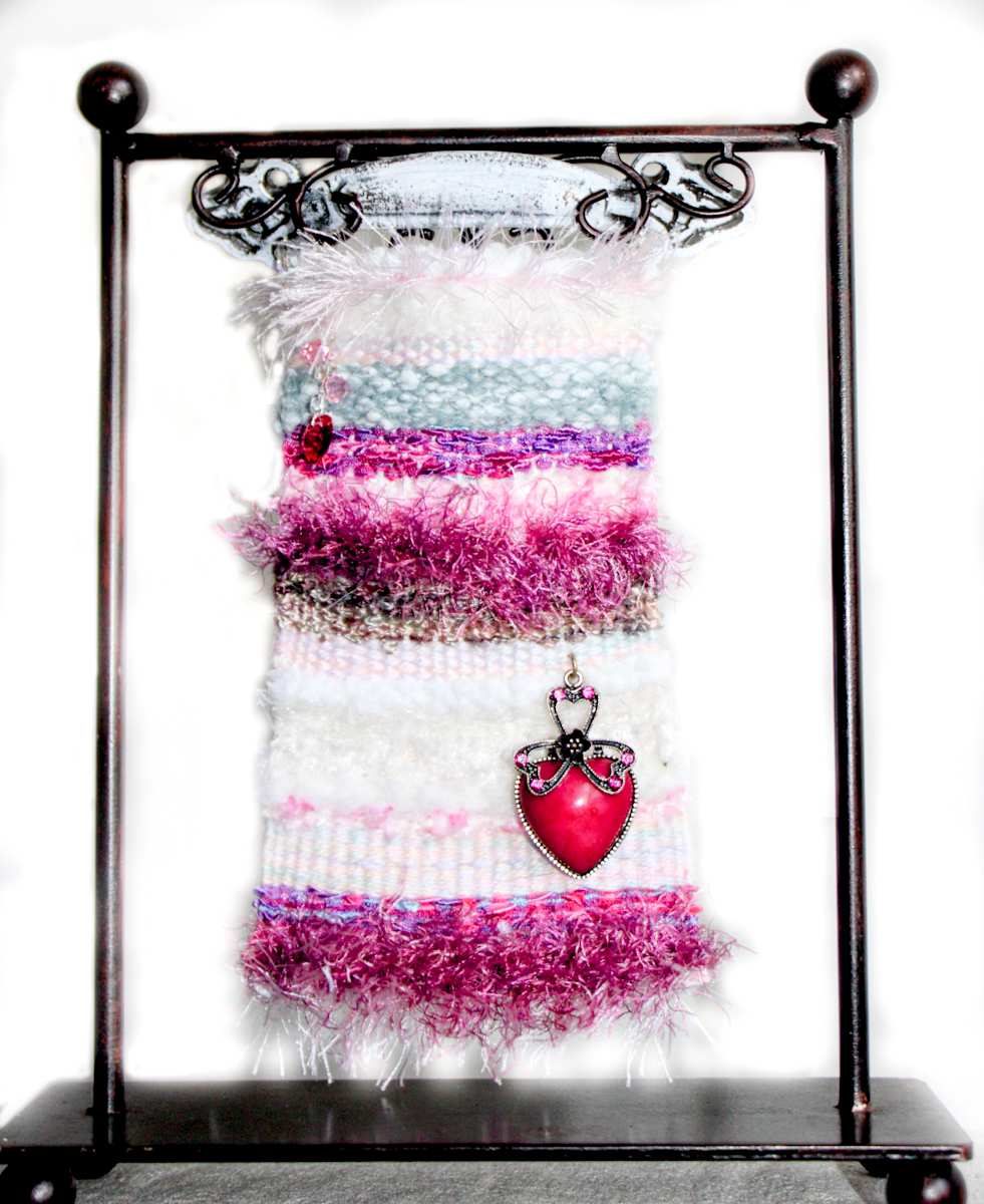 Pretty in Pink Mini Art Tapestry by Annette  Image: One of the original 12 mini tapestries created, showcases unique yarns in cream, white, pinks, eyelash, fur, string and more! You will love the textures and the variety of pattern. Hand woven from found fibers, many vintage, most unique .
