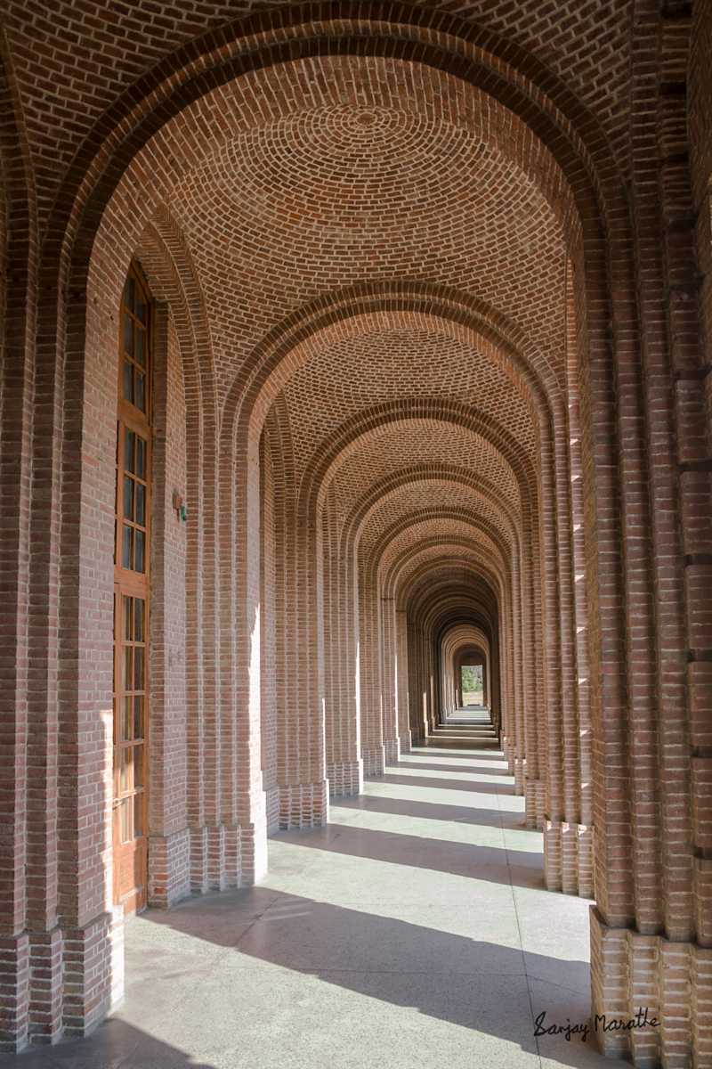 Arched Corridor-1, Dehradun (2005) by Sanjay Marathe  Image: The grand corridors of the Forest Research Institute in Dehradun exude timeless elegance, with their towering columns, arched walkways, and perfect symmetry. A masterpiece of Greco-Roman and Colonial architecture, they stand as a testament to classical design and craftsmanship. The Institute was established in 1906 as the Imperial Forest Research Institute to advance forestry research and conservation in India.