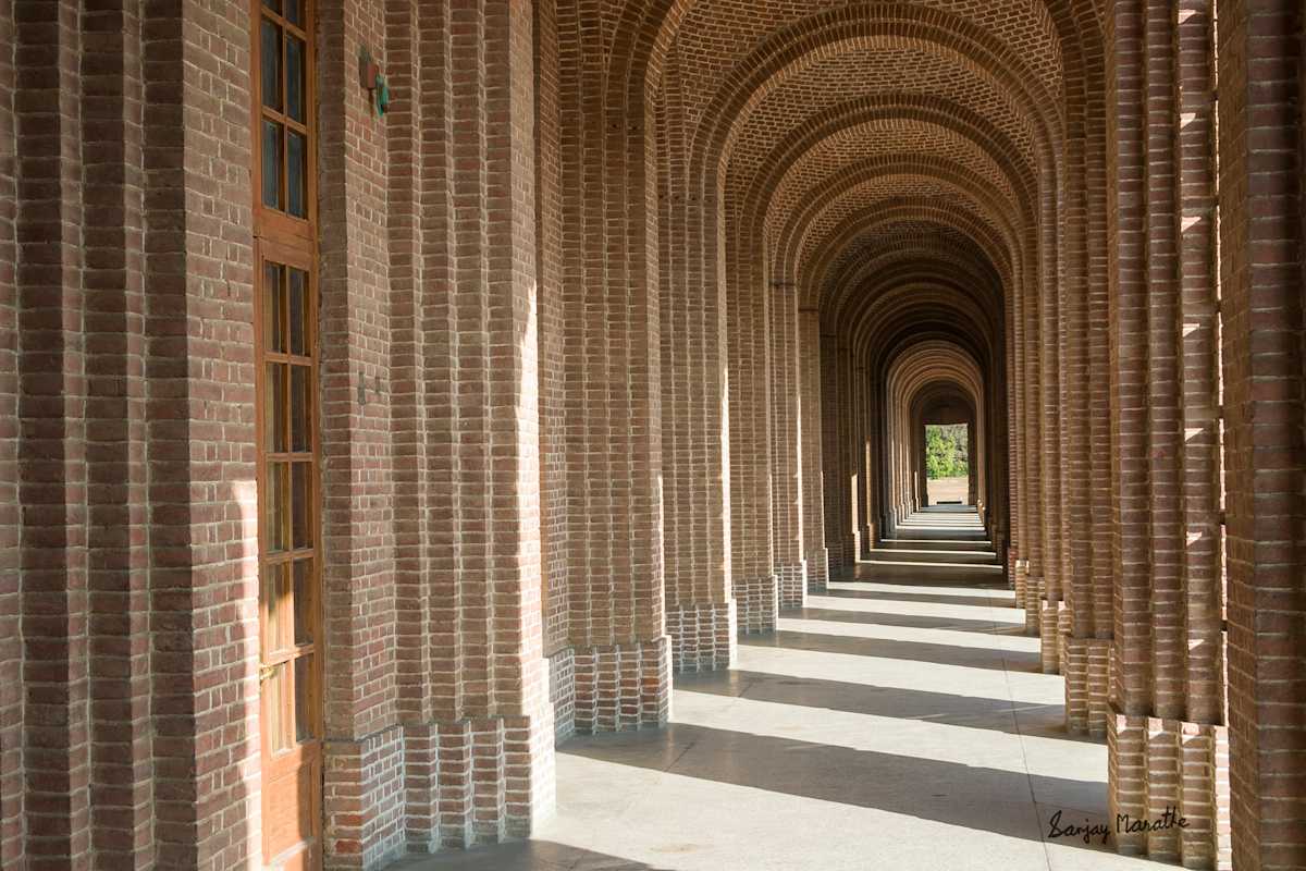 Arched Corridor-2, Dehradun (2005) by Sanjay Marathe  Image: The grand corridors of the Forest Research Institute in Dehradun exude timeless elegance, with their towering columns, arched walkways, and perfect symmetry. A masterpiece of Greco-Roman and Colonial architecture, they stand as a testament to classical design and craftsmanship. The Institute was established in 1906 as the Imperial Forest Research Institute to advance forestry research and conservation in India.