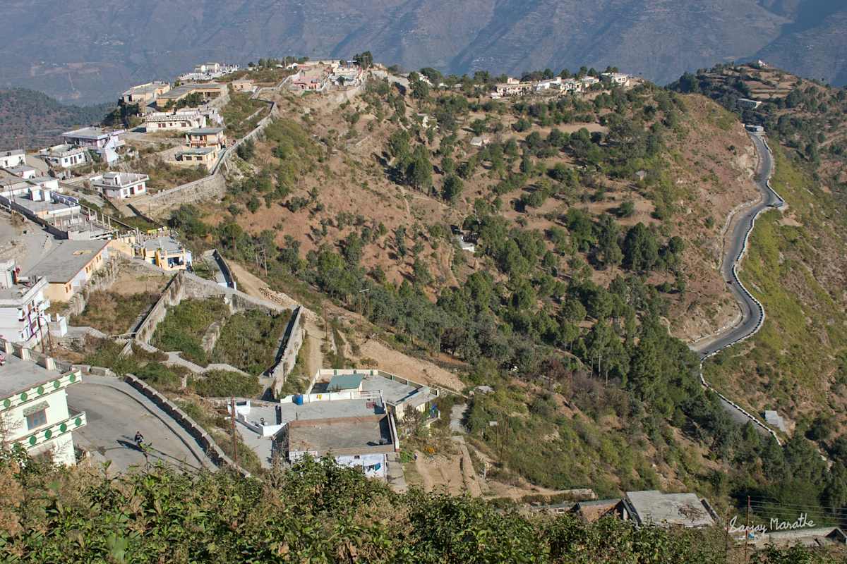 Winding Road-1, New Tehri (2005) by Sanjay Marathe  Image: Clusters of houses and a winding road in the town of New Tehri in Garhwal, in Uttarakhand state of India. The Tehri dam project was completed in 2006, and the new town called New Tehri was built for the residents of old Tehri town submerged by the dam.