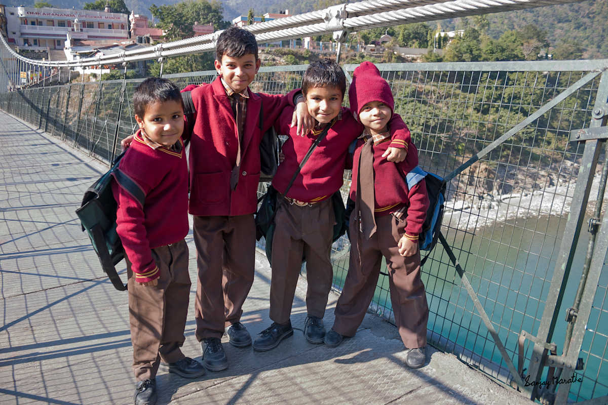 Schoolboys-1, Rishikesh (2005) by Sanjay Marathe  Image: School friends strike a pose on Laxman Zhoola bridge at Rishikesh, Uttarakhand, India.