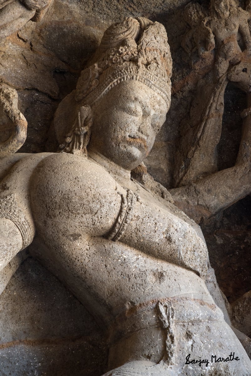 Nataraja Shiva Sculpture, Elephanta Caves, Mumbai (2016) by Sanjay Marathe  Image: The serene Shiva sculpture is located deep inside a rock cut cave at Elephanta island near Mumbai. It dates back to the mid 5th - 7th century CE. Though sculpted in the very hard basalt rock, it beautifully depicts the serene expression. With very low available light and no tripods permitted, I had to photograph it handheld, with a digital SLR camera.