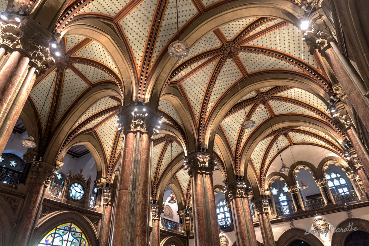 Ornate Ticket Hall, Victoria Terminus, Mumbai by Sanjay Marathe  Image: I set out to capture the architectural beauty and the intricately designed ceiling of the ticket booking hall at the historic Victoria Terminus (now Chhatrapati Shivaji Maharaj Terminus), a UNESCO World Heritage Site in Mumbai, built in 1887 CE. Serving nearly 3 million commuters daily, this bustling station often leaves little time for people to pause and admire its timeless grandeur. This framed artwork, available in both color and black-and-white, brings a touch of elegance and sophistication to any space, celebrating the station's rich heritage.