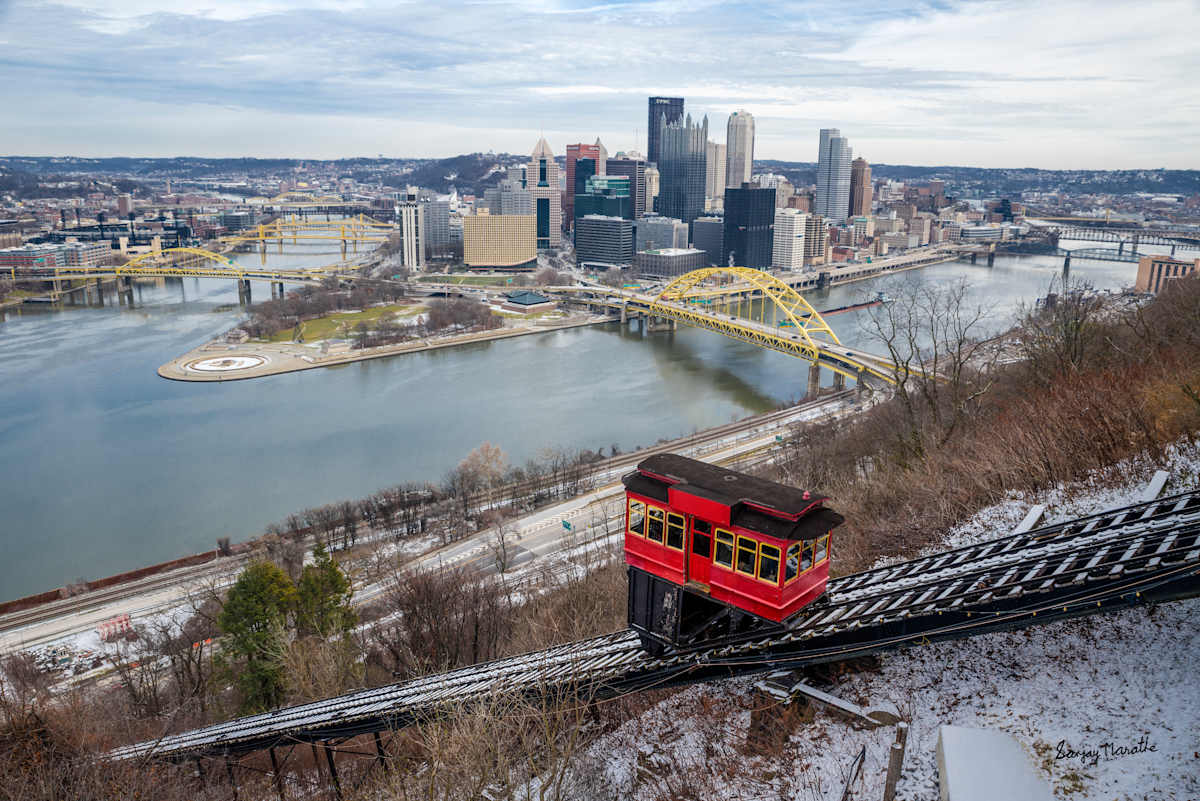 Golden Triangle, Pittsburgh (2024) by Sanjay Marathe  Image: A view of Pittsburgh's Golden Triangle and the Duquesne Incline, captured the day after a snowfall. Despite the clear skies, the snow remained untouched, preserved by the sub-zero temperatures.