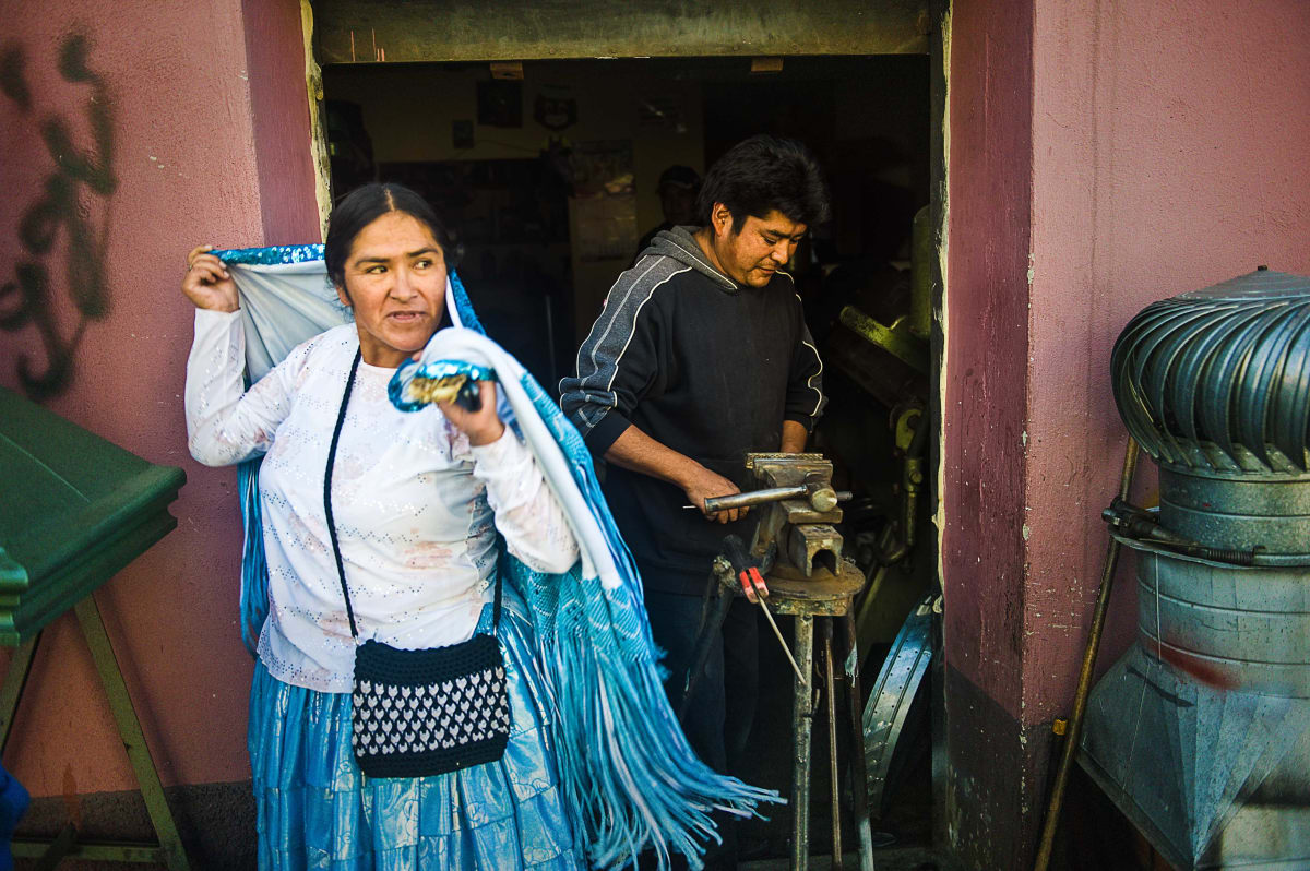 Untitled  Image: Julia throwing her mantle over her shoulders outside a shop in La Paz.
