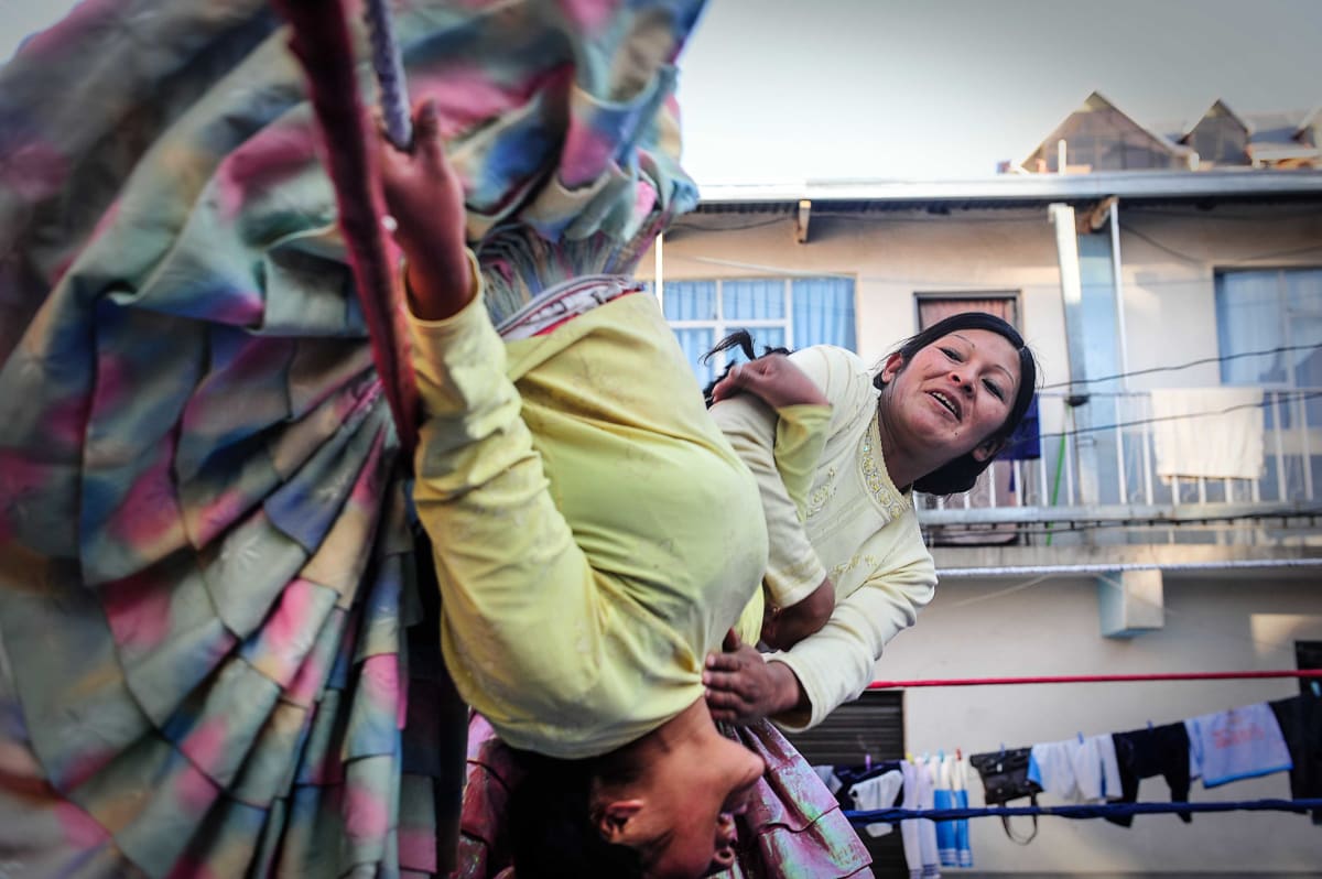 Untitled  Image: Yolanda helping Julia rehearse her acrobatic moves during training.