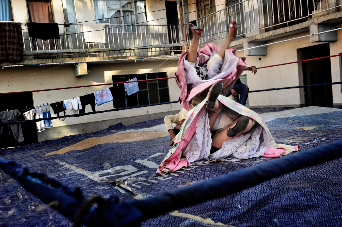 Untitled  Image: Julia and Yolanda rehearse their acrobatics together during training, allowing a glimpse of the embellishments of their petticoats.