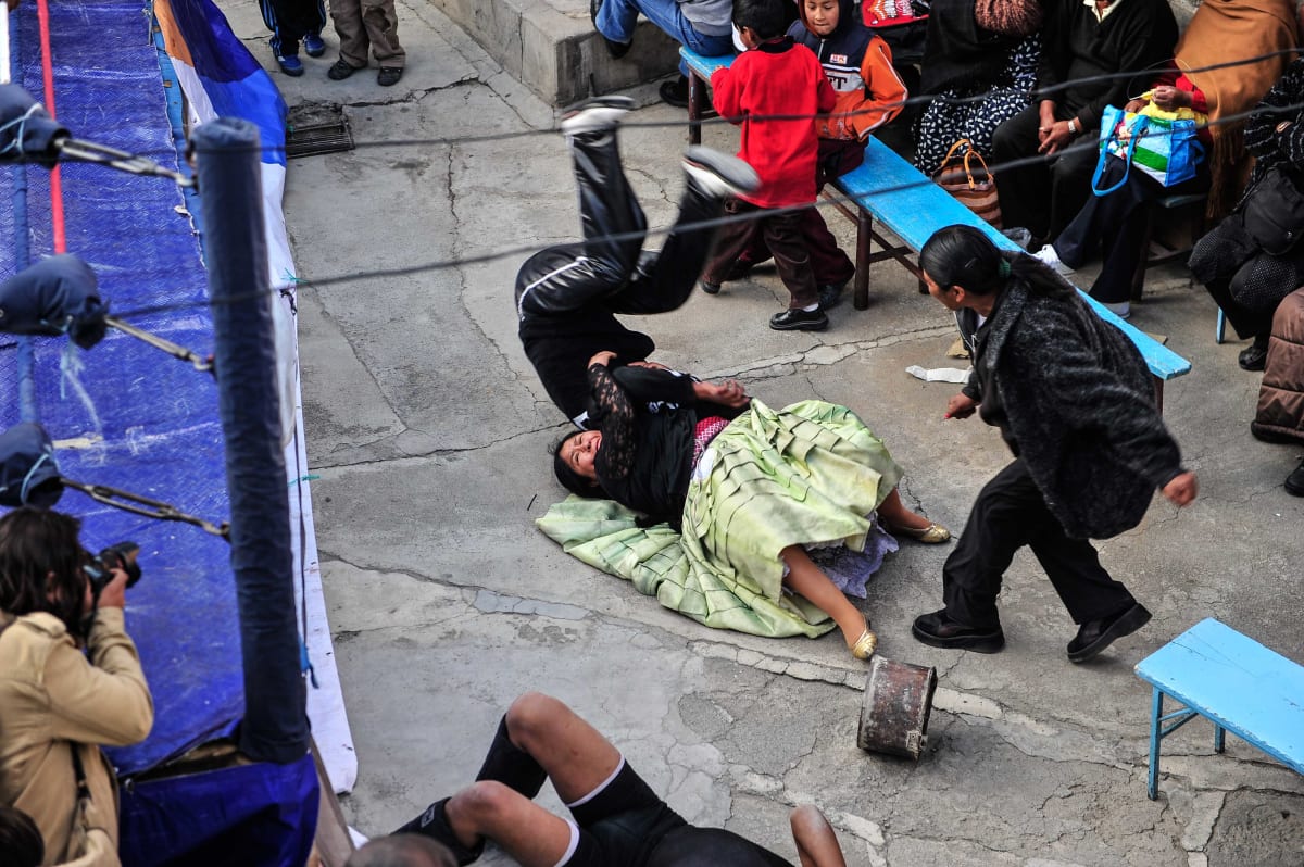 Untitled  Image: Carmen Rosa fighting a luchador off-ring during a match.