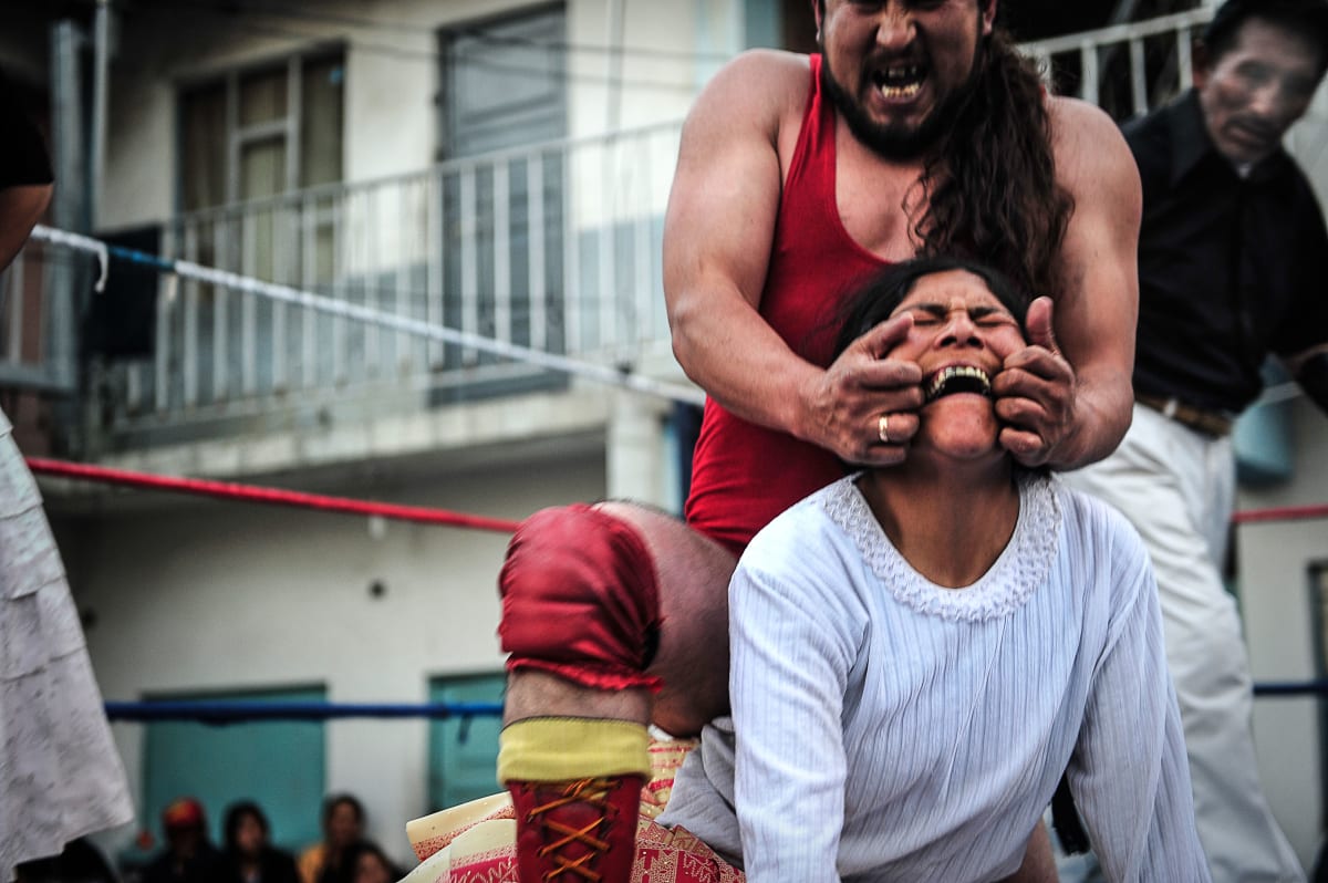 Untitled  Image: Dina performing with a luchador on the ring.