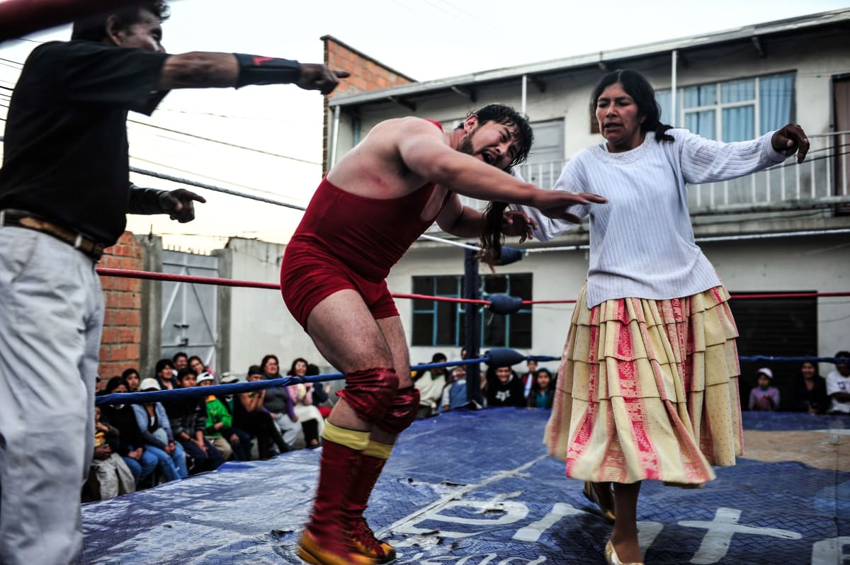 Untitled  Image: Dina pulls the hair of a luchador during a performance.