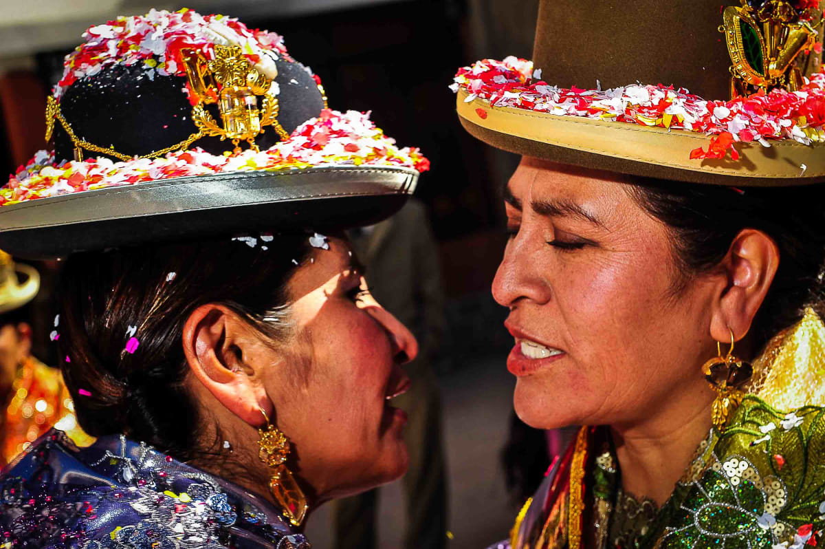 Untitled  Image: Two cholitas saluting each other during the parade of Miss Cholita 2010 in La Paz.