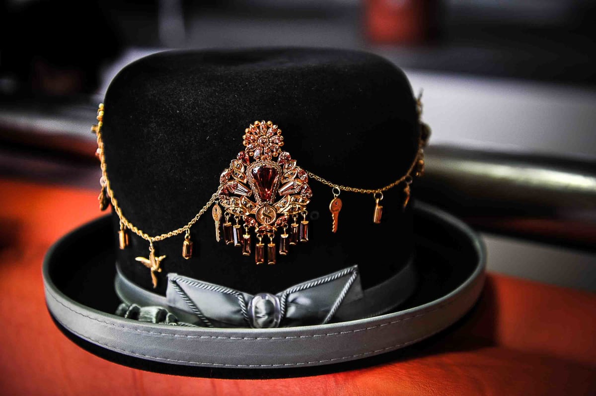 Untitled (Cholita's Hat)  Image: Cholita's hat, embellished with golden trinkets.
