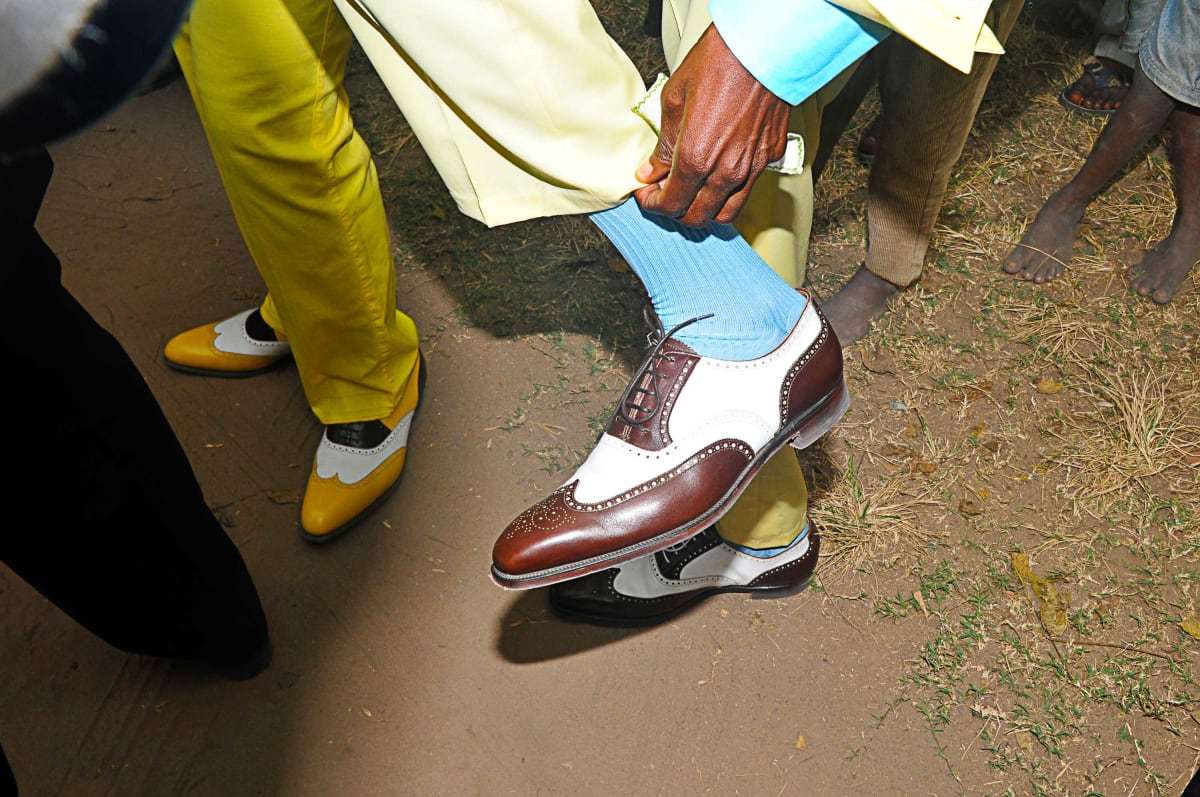 Untitled (Sapeur Shoes)  Image: Sapeurs showing off their shoes to the camera.