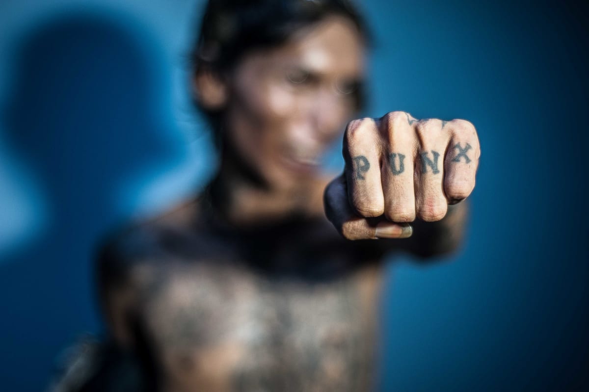 Untitled (Punx)  Image: Skum, leader of the band KulturShock, showing his tattoo.