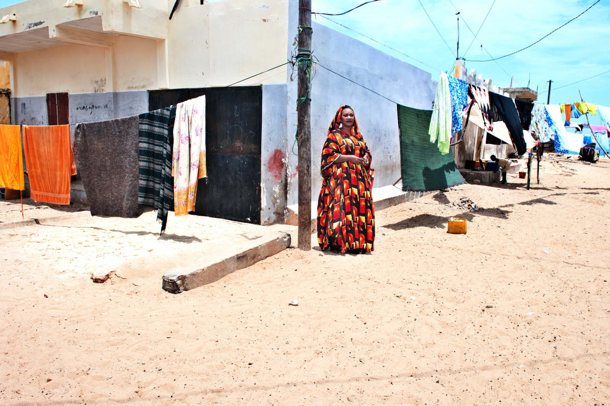 Untitled (Famaraba Mbaye)  Image: Famarama Mbaye, elegant Senegalese woman, standing in traditional waxpring on the corner of a street in Dakar.