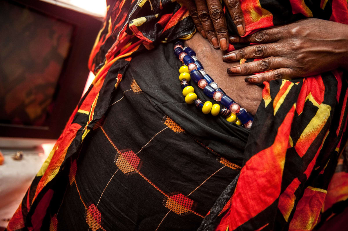Untitled  Image: Famarama Mbaye showing her necklaces.
