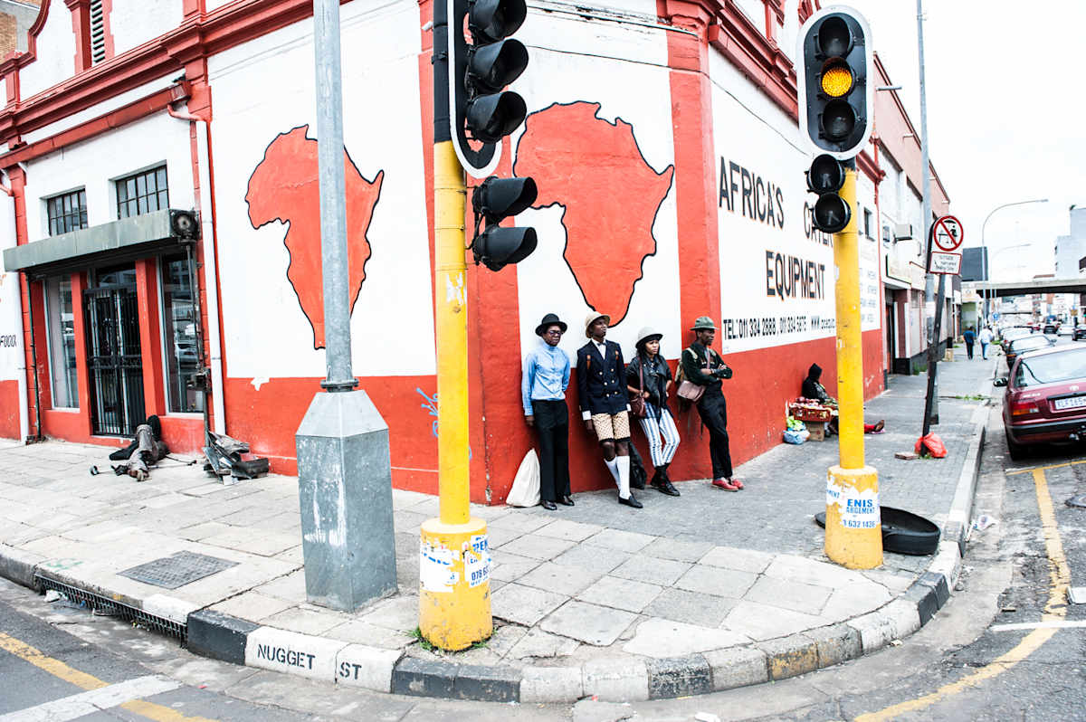 Untitled (Nugget Street) by Daniele Tamagni Foundation  Image: The Smarteez posing at the intersection with Nugget Street in Johannesburg