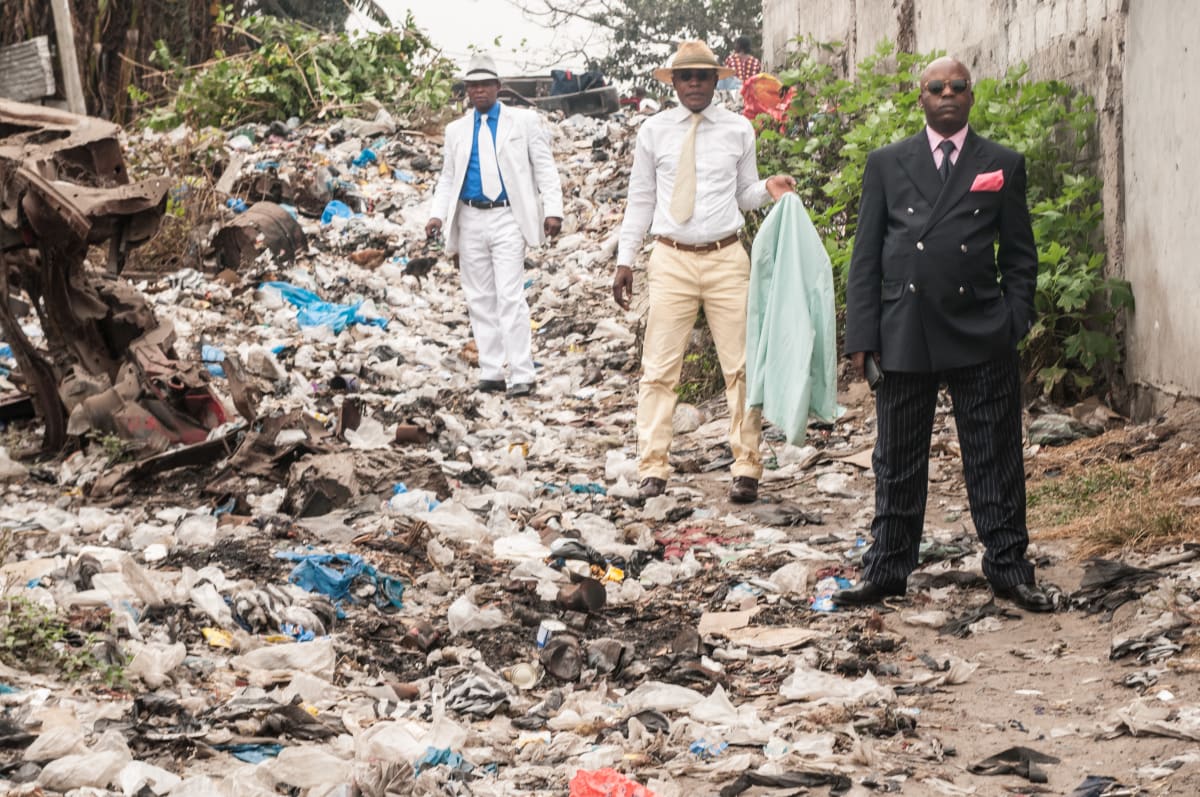 Untitled  Image: Dany Blaise (center), Mayembo (right) and a friend - the Sapeurs de Moukondo - posing on a street of Brazzaville. Congo (2008)