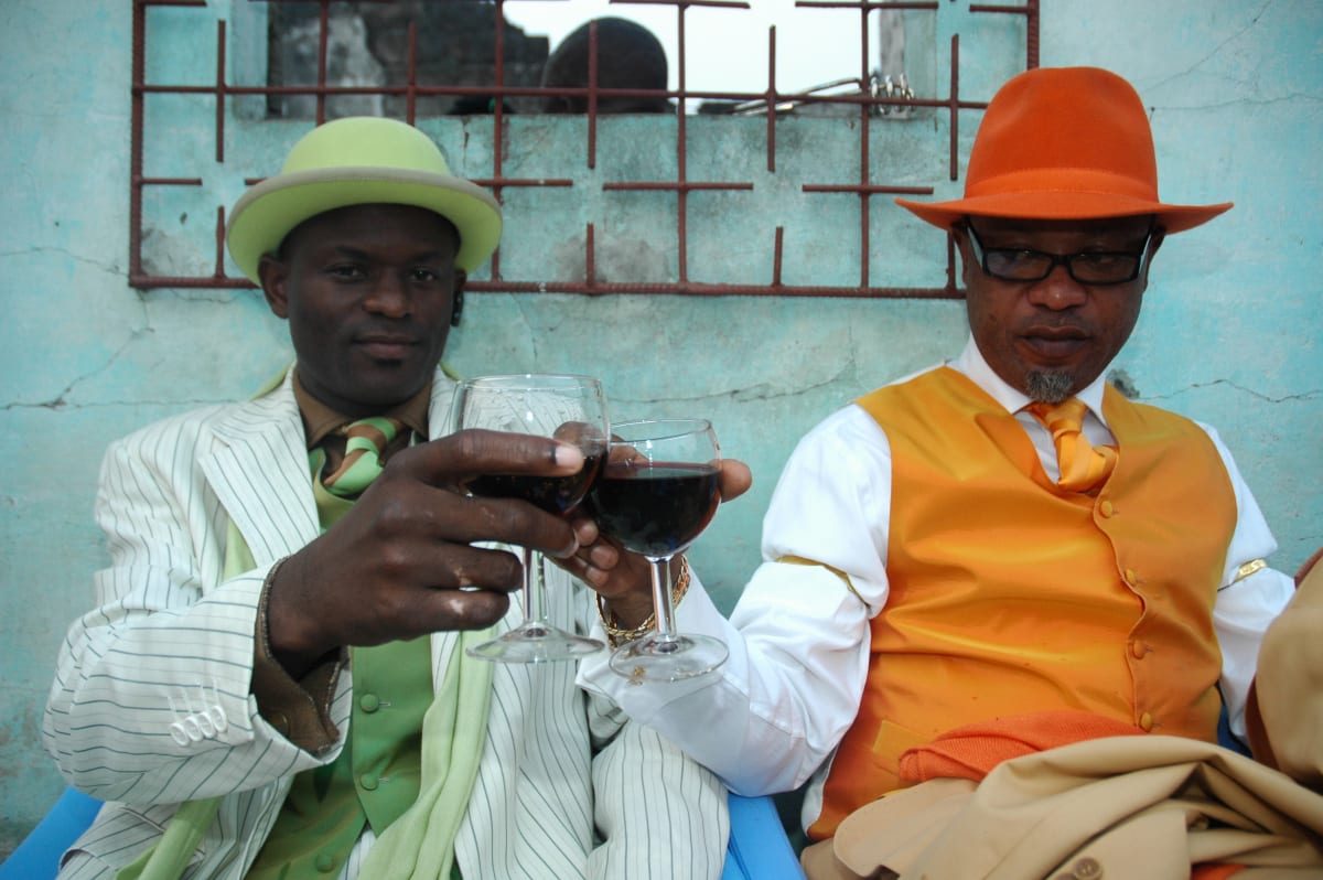 Untitled  Image: Kvv Mouzieto and his brother Ange Bienvenu Mouzieto toasting with red wine at a brithday party. Brazzaville, Congo (2007).