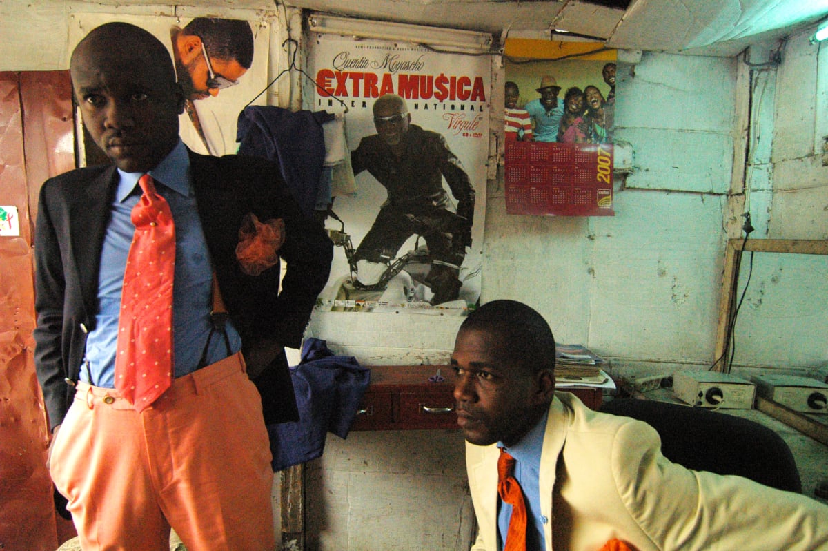 Untitled  Image: Salvador Hassan and Phael in a room. Behind them a poster of Quentin Moyascko 'Extra Musica' and a 2007 calendar. Brazzaville, Congo (2007)