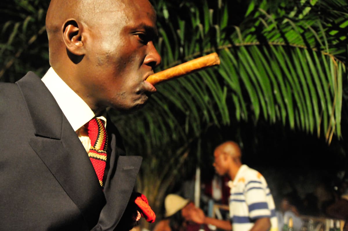 Untitled  Image: Profile of a man with an unlit cigar in his mouth at the nightclub Main Bleu, Brazzaville, Congo (2008)